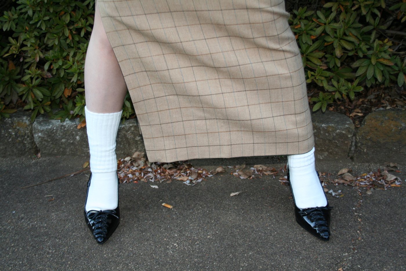Kersey checker suit detail, the long checked skirt with white socks and heels