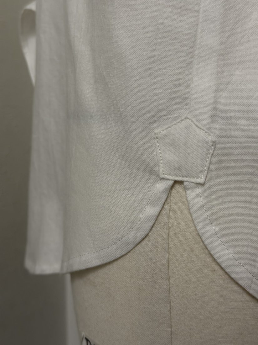 Close-up of the curved shirttail hem with reinforced side-seam gusset