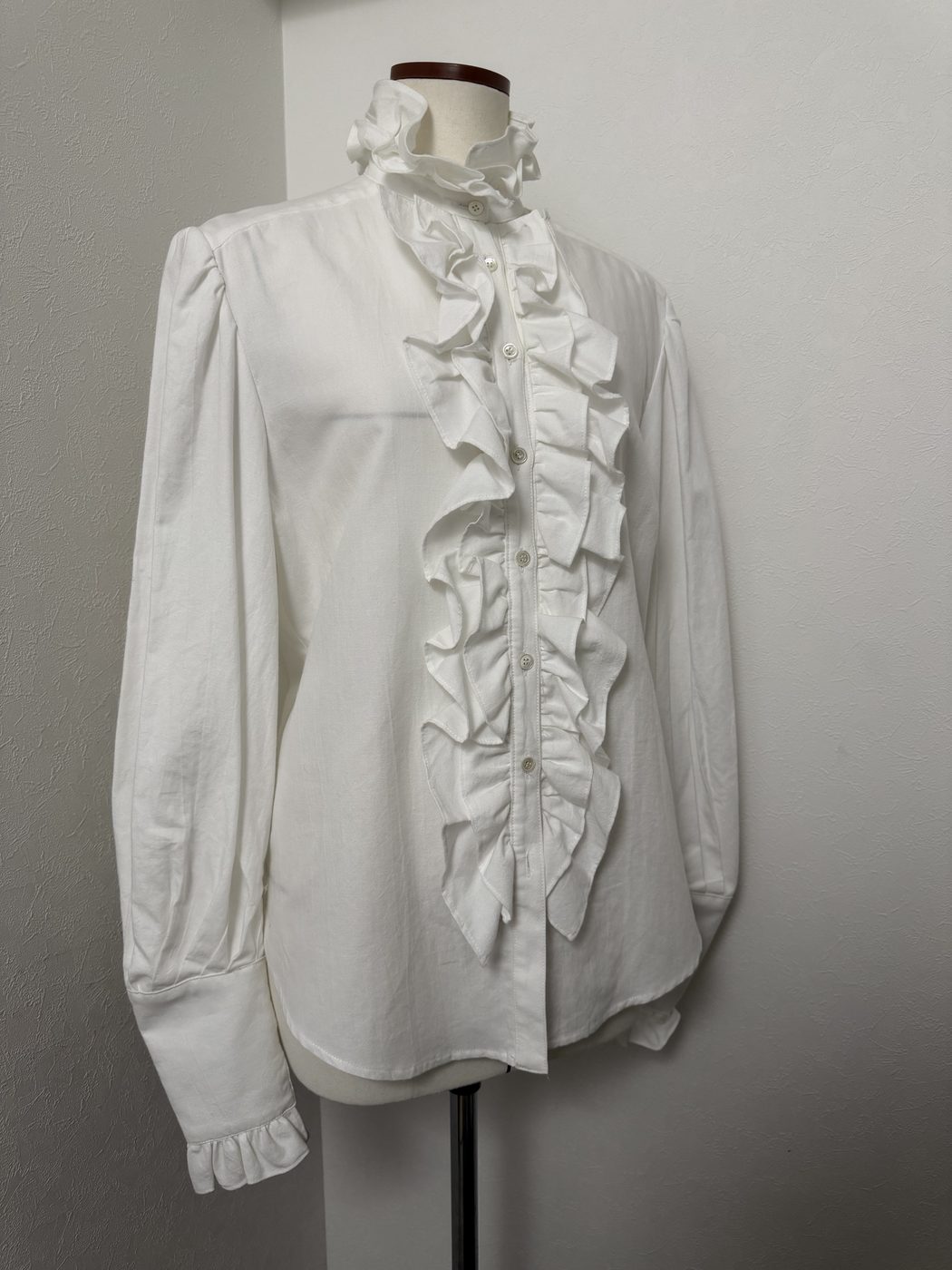 Linen shirt blouse, front view on dress form, showing ruffled jabot and stand collar